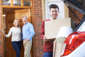 A student loads up the car to move into a dorm and storage unit