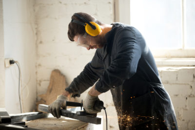 A homeowner using power tools after retrieving them from a storage unit