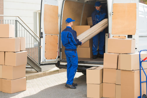 Workers loading a moving truck